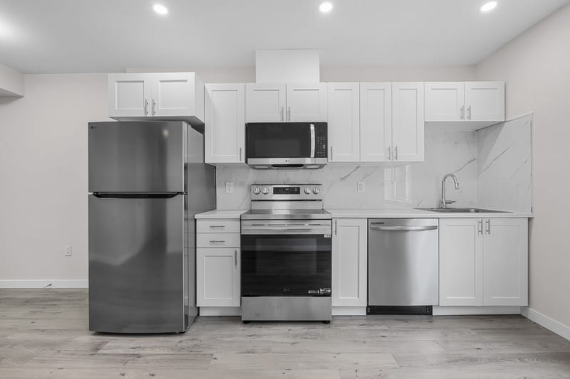 The kitchen run, with the dishwasher and the range